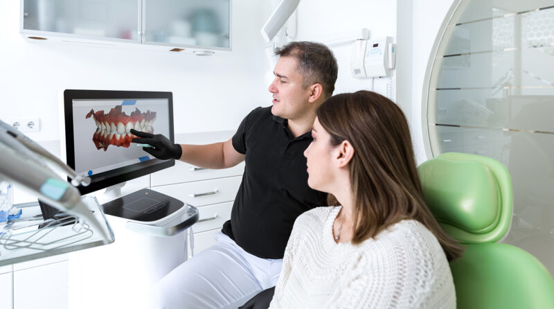 dentist showing patient digital scan